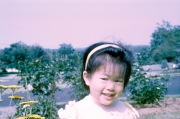 Christine smelling flowers